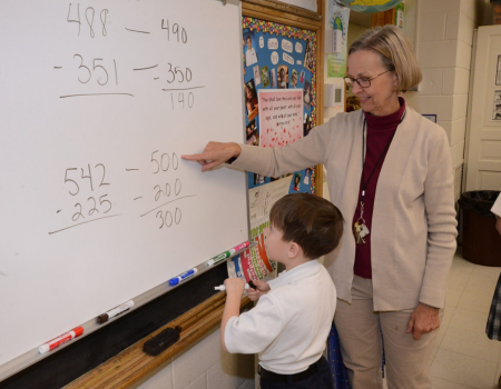 Faculty working with students