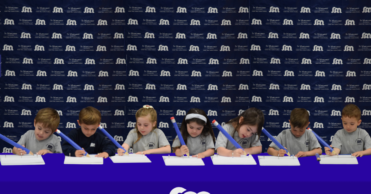 Students welcoming new families at admissions